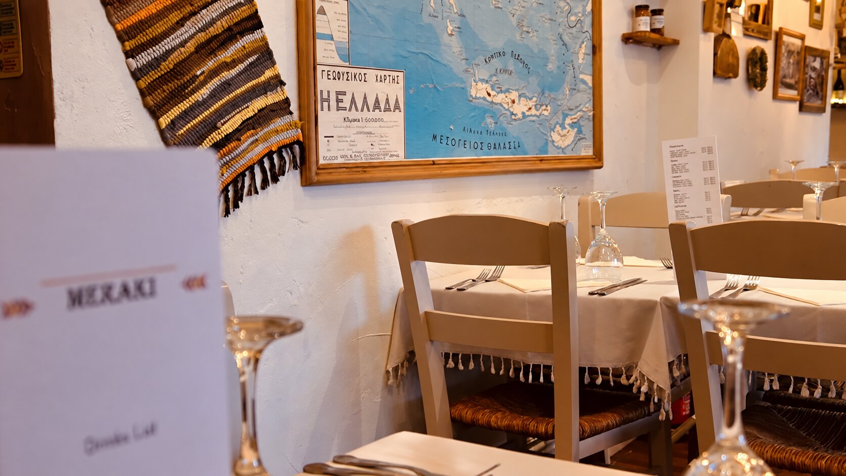 Warm lights and tables inside Meraki on Abbeydale Road